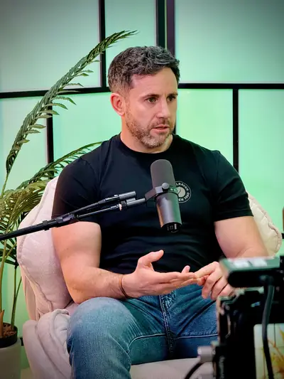 Guest lit in green during a studio podcast interview